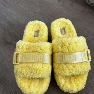 Yellow Ugg platform slide
